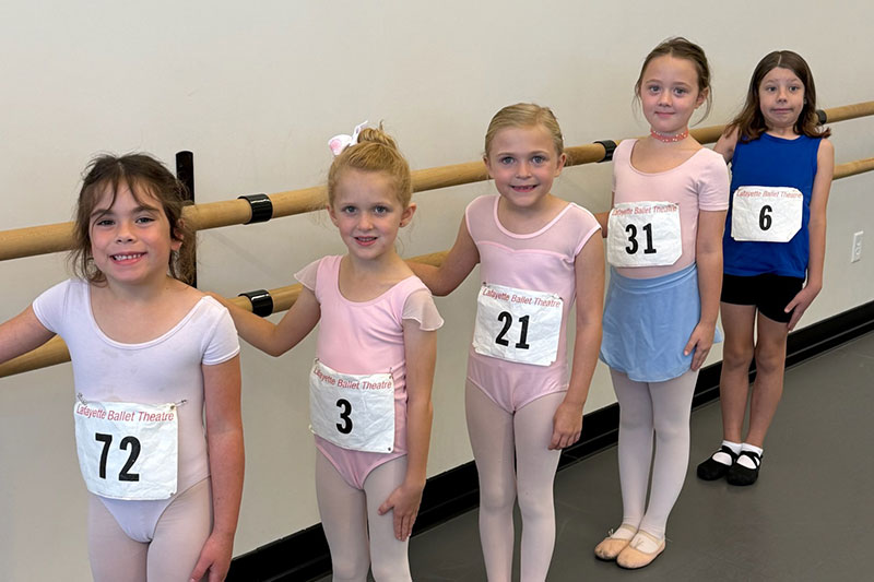 Dancers jumping as peppermints in The Nutcracker.